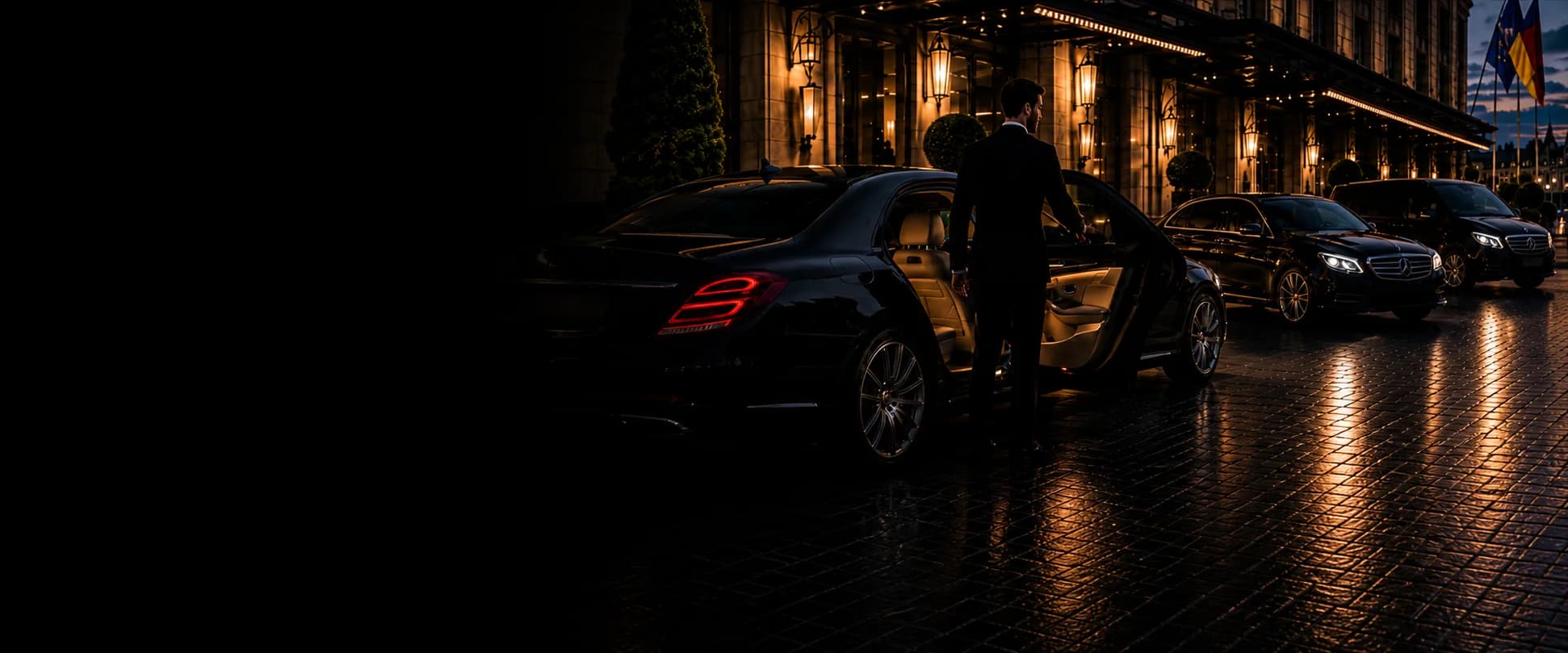 Chauffeur opening a luxury sedan at a hotel